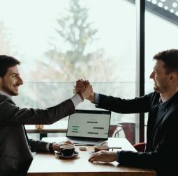 Businessman shaking hand to his partner on meeting, positive management team celebrating victory, successful stock deal, sales growth, won good contract, business achievement and teamwork concept